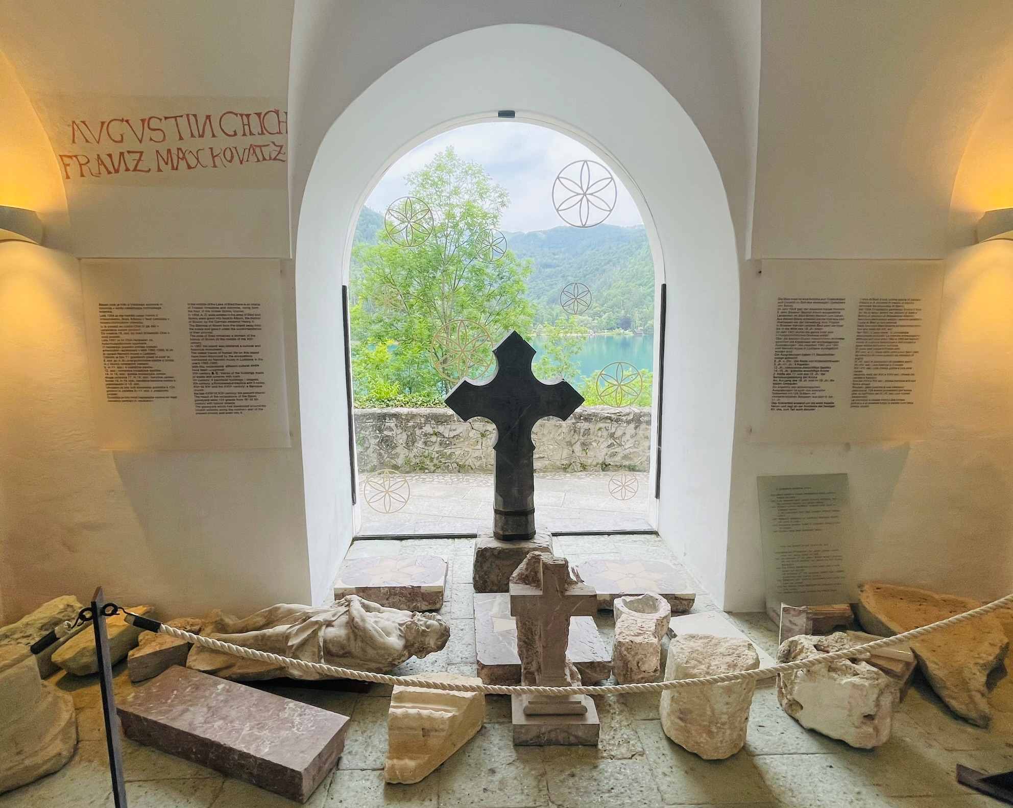 Interior of the church and its cross on island in Lake Bled - trieste slovenia with several granite pieces on ground